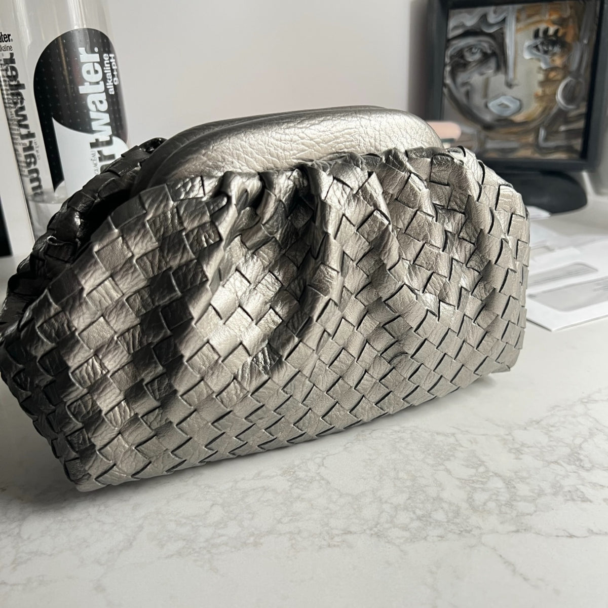 Steely woven clutch bag